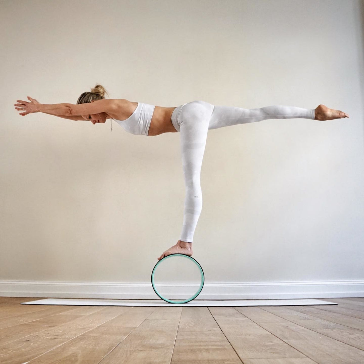 @ania_75 wearing White Camouflage Vapor Leggings with a matching White Camouflage Vapor Wild Thing Bra during her yoga practice. 